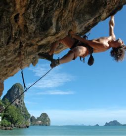 Challenging yourself with rock climbing.